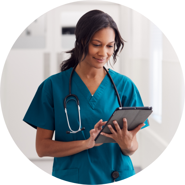 Healthcare professional reviewing a tablet